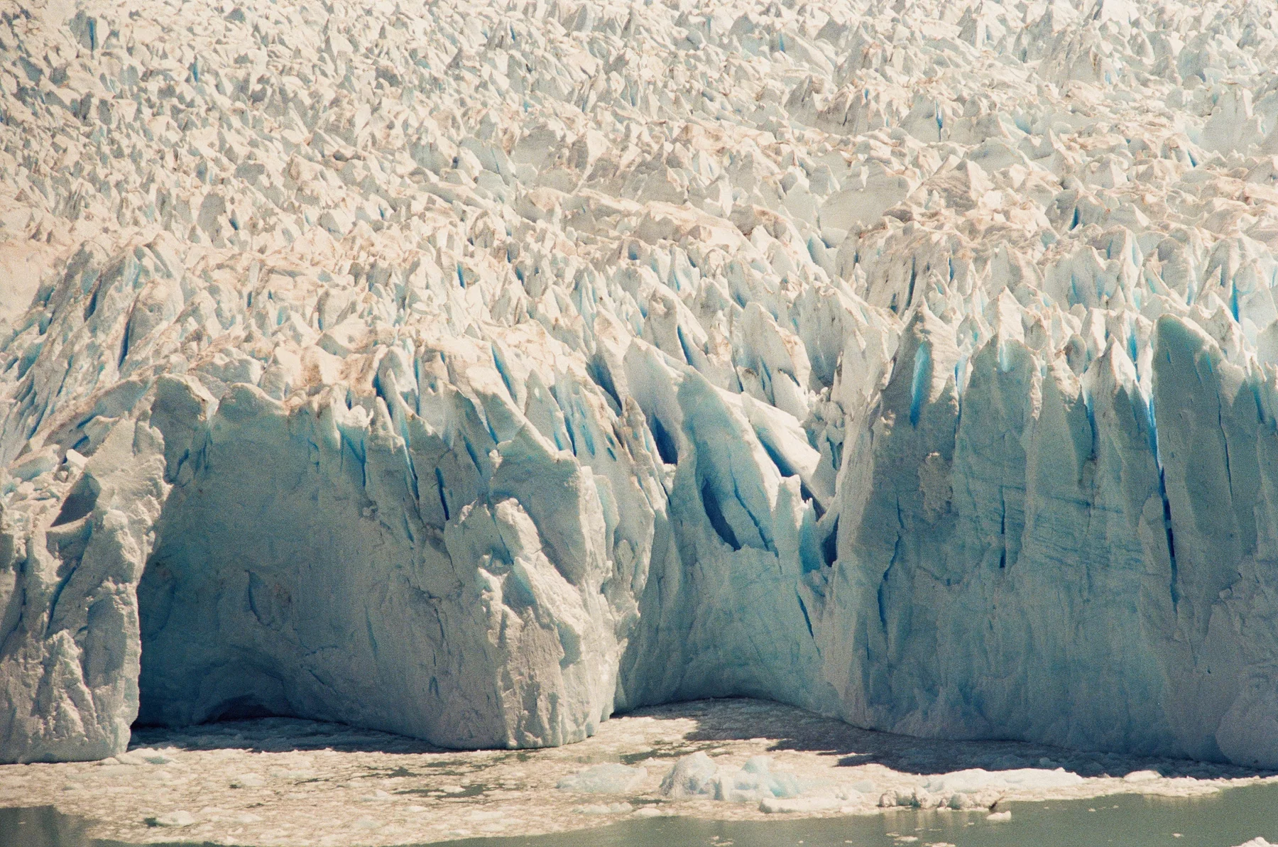 The fractured blue face of a glacier