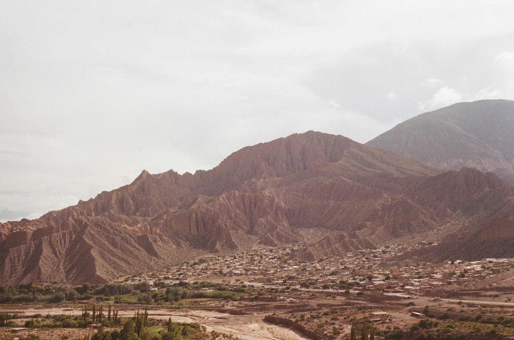 Layered mountains above a quiet village