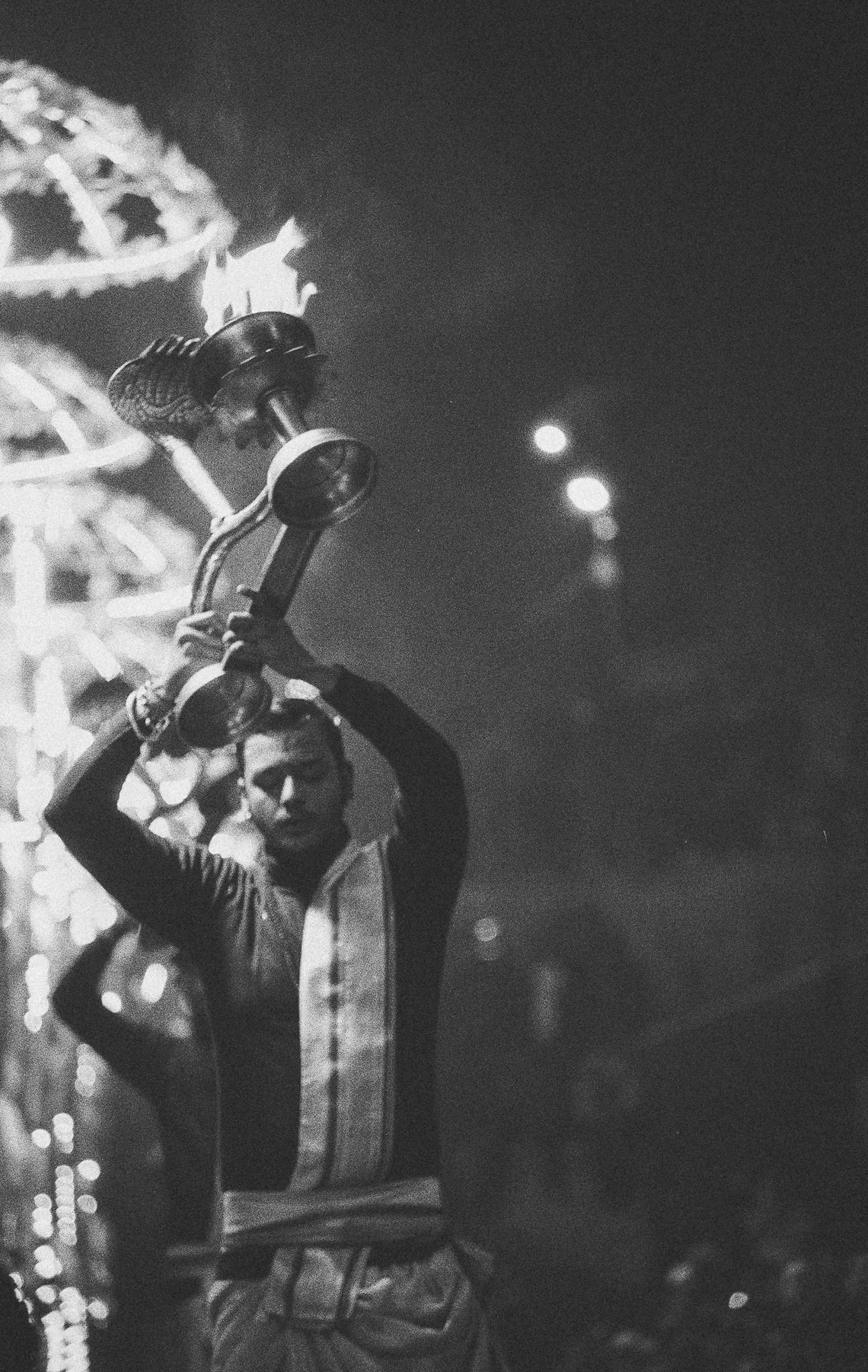 A performer lifting a brass instrument overhead
