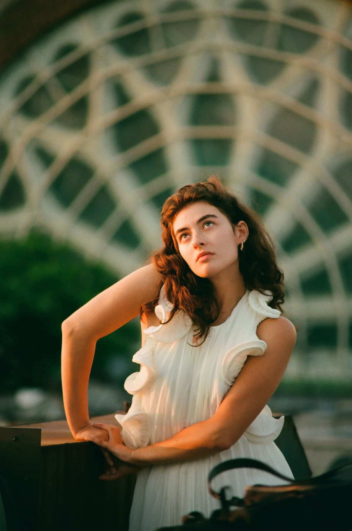 An outdoor portrait in soft green light