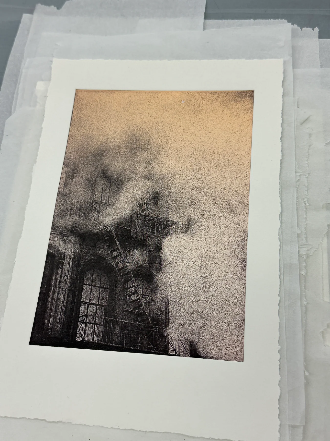 A warm-toned variation of the building photogravure on paper